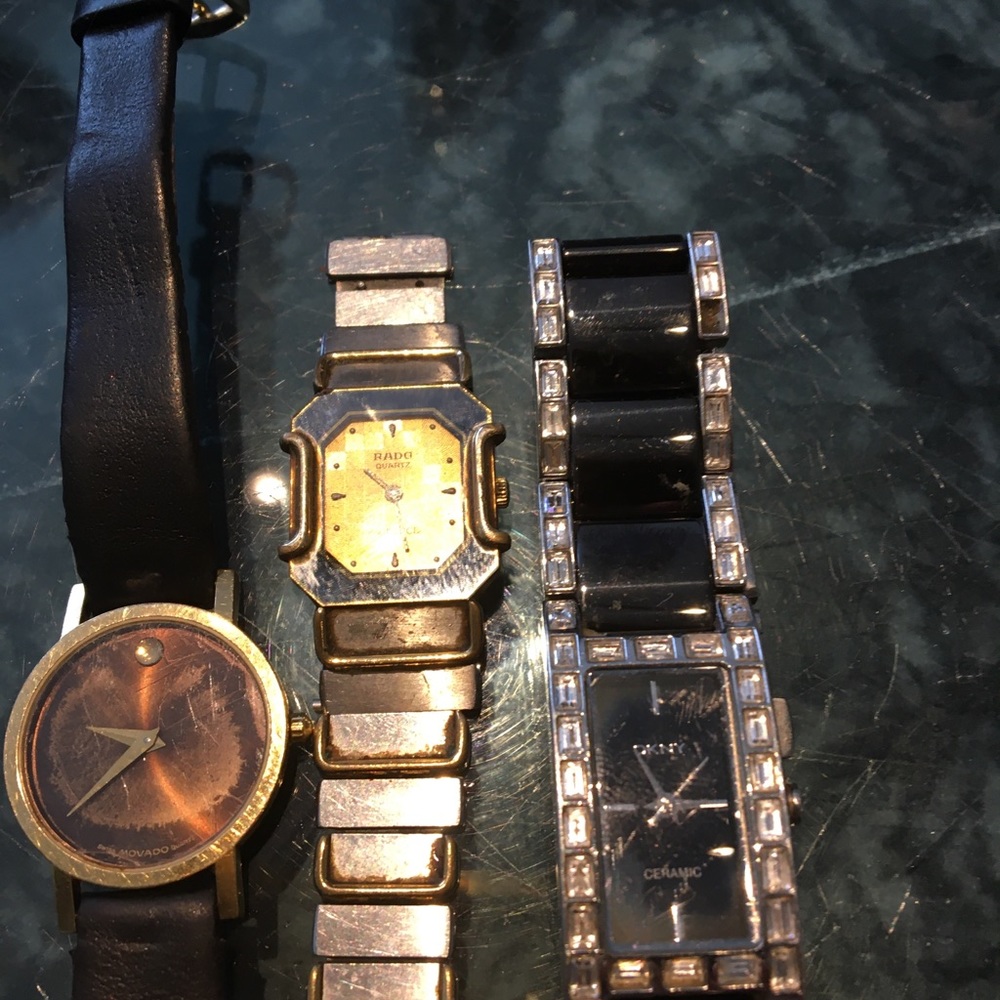 Three watches guess movado and rado